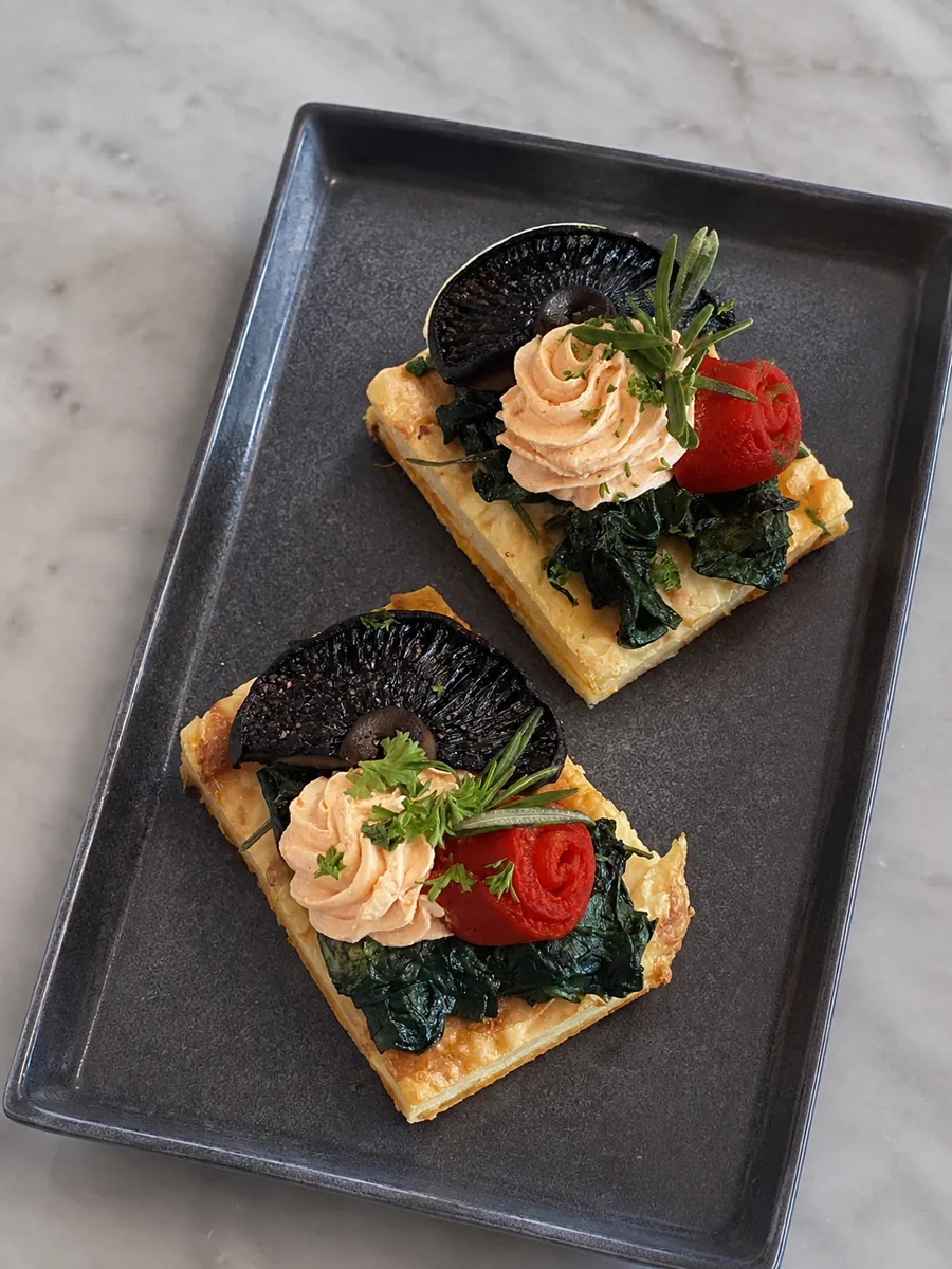 Savoury tartines topped with mushrooms, spinach and tomato